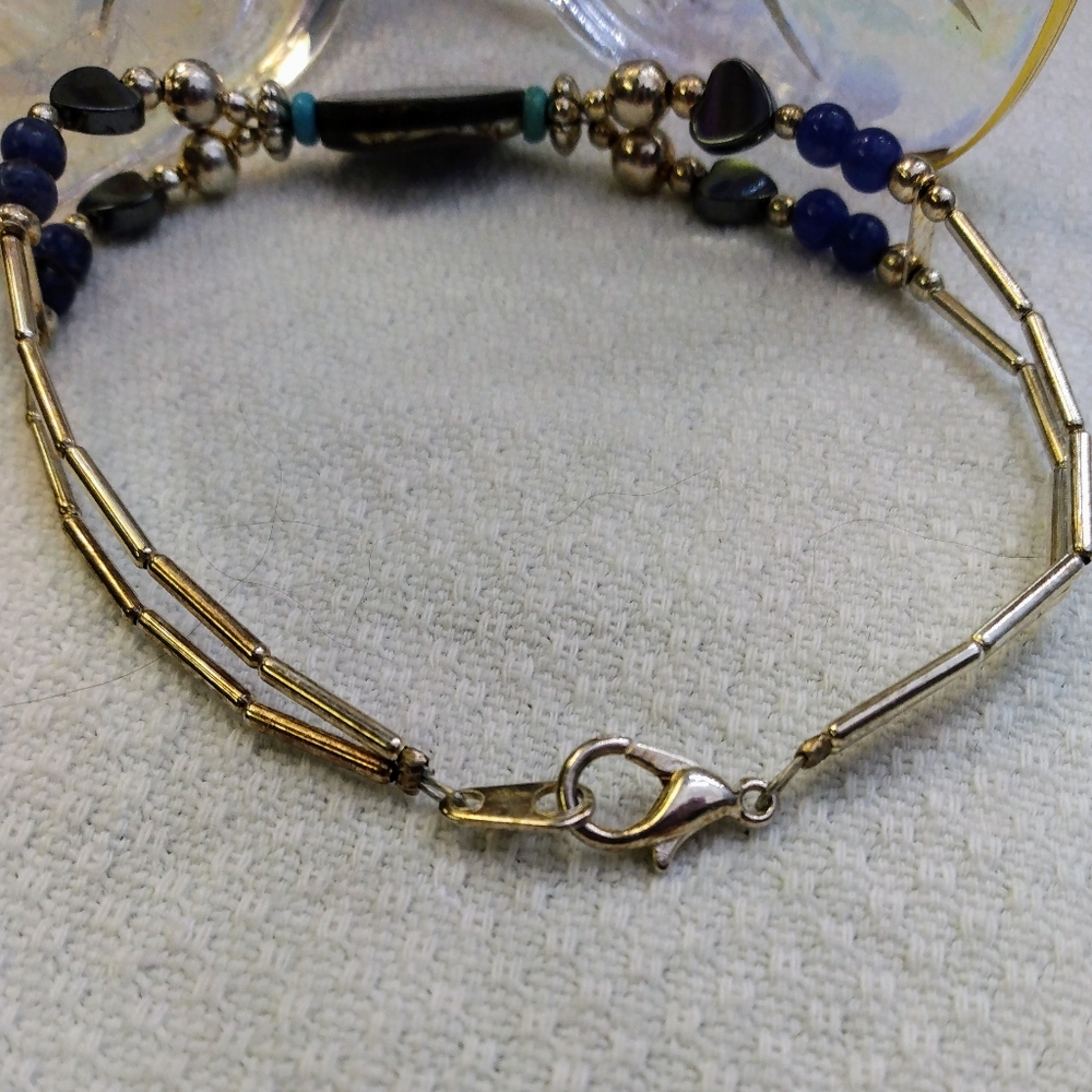 Women's multi stone bracelet with silver tone accents. 8". Good used condition. - Picture 4 of 11